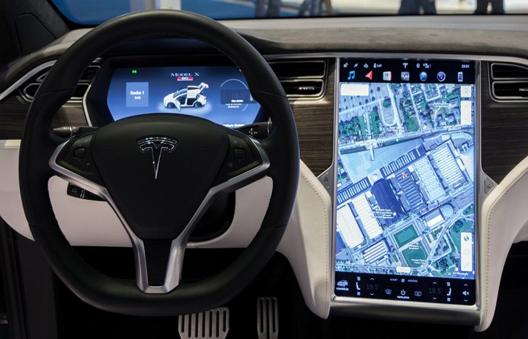 Description: Interior dashboard with navigation of Tesla vehicle