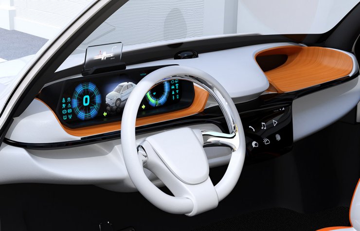 Description: Closeup view of digital speedometer with HUD on wooden tray. Electric car's dashboard concept.